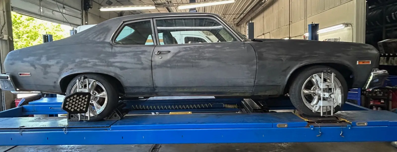 Classic Chevrolet Nova on the alignment rack at Pitt Stop Tire & Auto in Xenia, OH